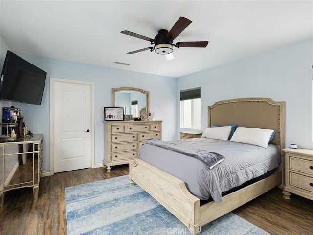 5243 E Monlaco Rd, Long Beach, CA 90808 - bedroom with dark wood-style floors and a ceiling fan