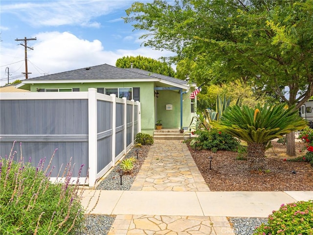 5243 E Monlaco Rd, Long Beach, CA 90808 - view of front of house featuring stucco siding and roof with shingles