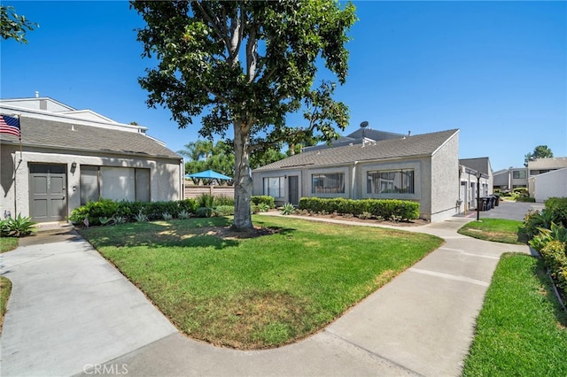 17842 Beard Ln Unit 88, Huntington Beach, CA 92647 - view of front of house with a front yard and stucco siding