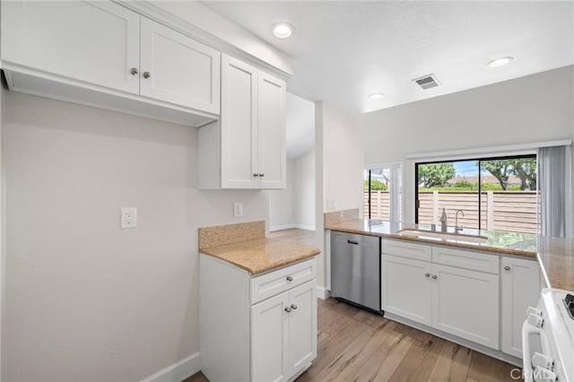 17842 Beard Ln Unit 88, Huntington Beach, CA 92647 - kitchen with dishwasher, gas range gas stove, white cabinets, light wood-style floors, and recessed lighting