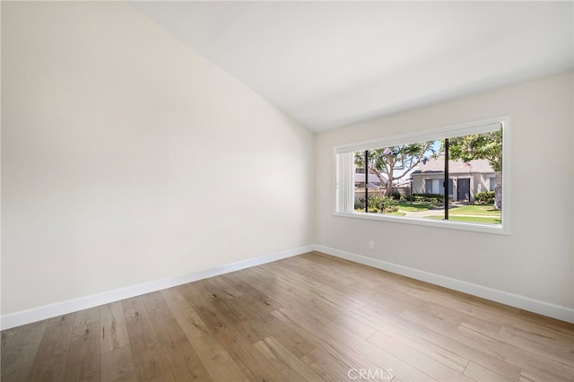 17842 Beard Ln Unit 88, Huntington Beach, CA 92647 - empty room with light wood finished floors and lofted ceiling