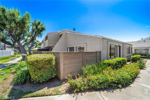 17842 Beard Ln Unit 88, Huntington Beach, CA 92647 - view of side of property featuring stucco siding