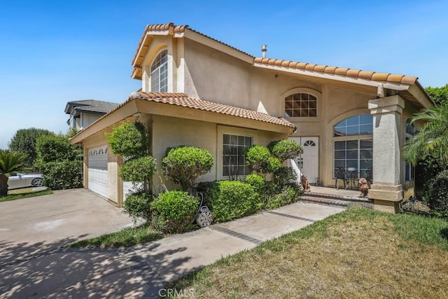 14226 Remington Ct, Fontana, CA 92336 - mediterranean / spanish-style home with a tile roof, stucco siding, driveway, and a garage