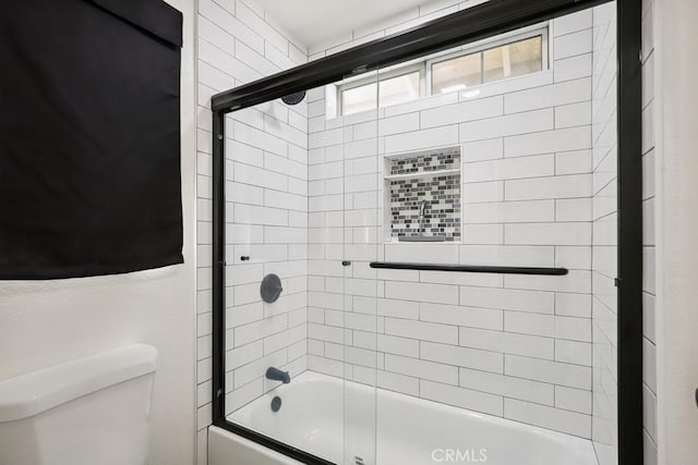 14226 Remington Ct, Fontana, CA 92336 - bathroom with toilet and bath / shower combo with glass door