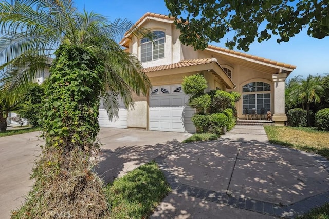 14226 Remington Ct, Fontana, CA 92336 - mediterranean / spanish-style home featuring a tiled roof, driveway, stucco siding, and an attached garage