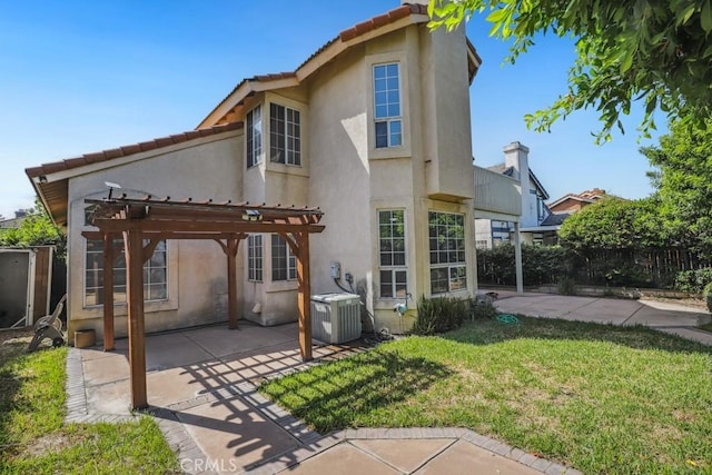 14226 Remington Ct, Fontana, CA 92336 - back of property featuring a pergola, a patio, stucco siding, and a tiled roof