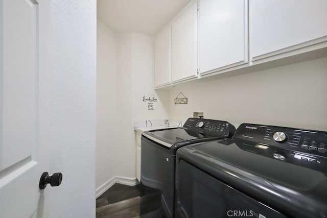 14226 Remington Ct, Fontana, CA 92336 - laundry area with cabinet space, washing machine and clothes dryer, and dark wood finished floors