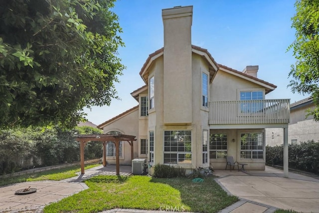 14226 Remington Ct, Fontana, CA 92336 - rear view of property featuring a chimney, a patio, a balcony, a pergola, and stucco siding
