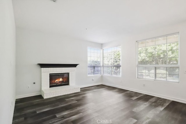14226 Remington Ct, Fontana, CA 92336 - unfurnished living room featuring dark wood-type flooring and a fireplace