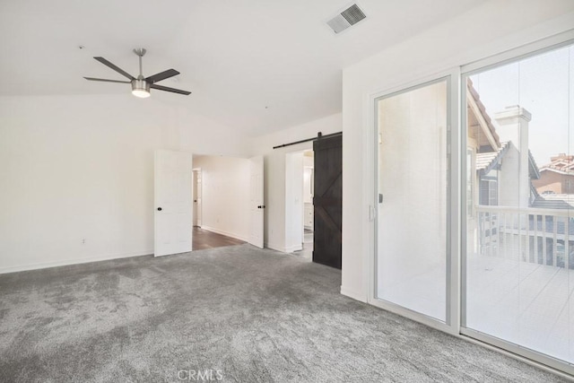 14226 Remington Ct, Fontana, CA 92336 - empty room with a barn door, ceiling fan, carpet, and lofted ceiling