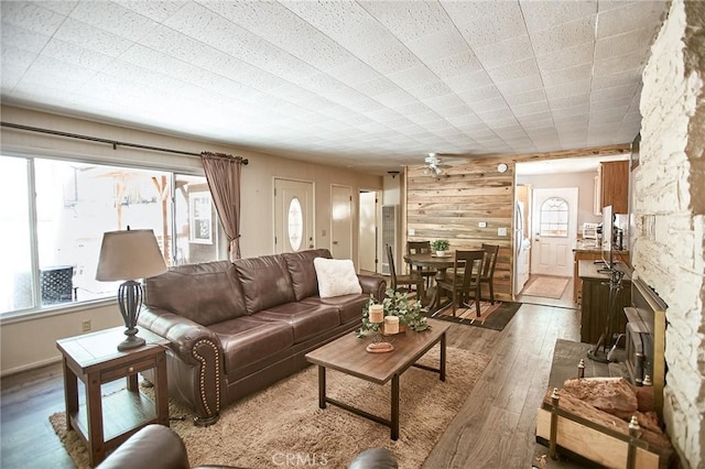 41394 Valley Of The Falls Dr, Forest Falls, CA 92339 - living room with hardwood / wood-style floors, wooden walls, and ceiling fan