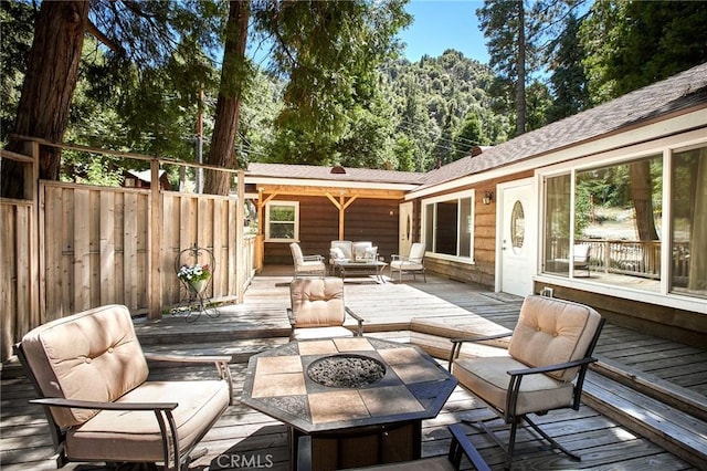 41394 Valley Of The Falls Dr, Forest Falls, CA 92339 - deck featuring an outdoor living space with a fire pit