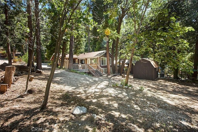 41394 Valley Of The Falls Dr, Forest Falls, CA 92339 - view of yard with a storage unit and a deck