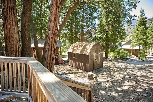 41394 Valley Of The Falls Dr, Forest Falls, CA 92339 - wooden deck featuring a storage shed