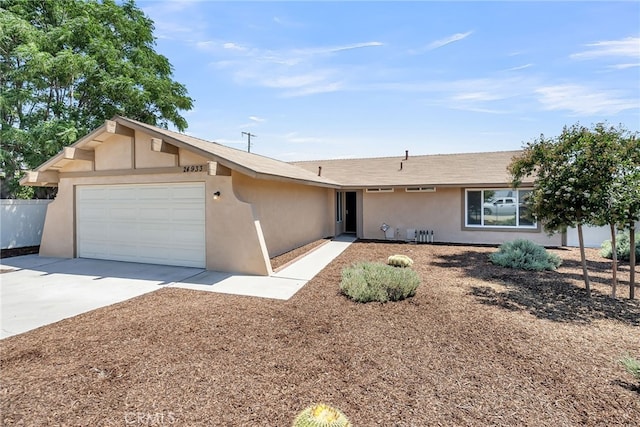 24933 Dracaea Ave, Moreno Valley, CA 92553 - ranch-style home featuring stucco siding, a garage, and driveway