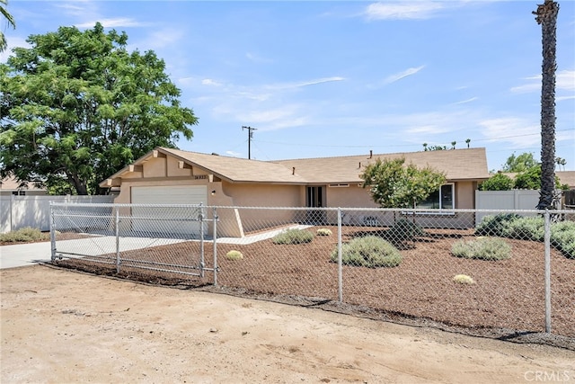 24933 Dracaea Ave, Moreno Valley, CA 92553 - single story home with stucco siding, an attached garage, concrete driveway, and a fenced front yard
