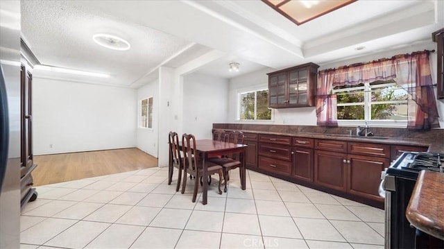 3139 W 152nd Pl, Gardena, CA 90249 - kitchen featuring gas stove, dark countertops, and light tile patterned floors