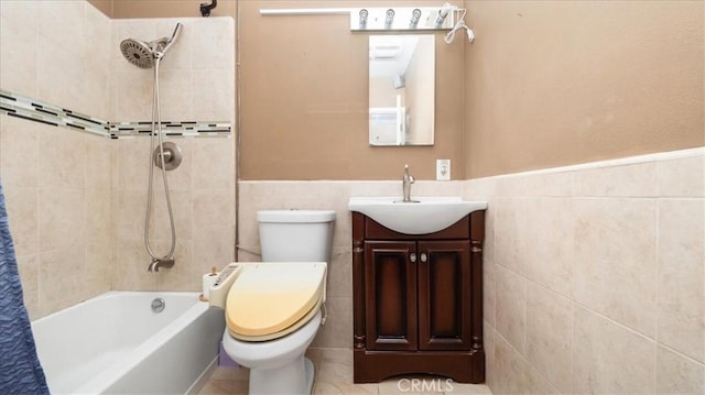 3139 W 152nd Pl, Gardena, CA 90249 - bathroom featuring tile walls, vanity, shower / bath combo with shower curtain, and wainscoting