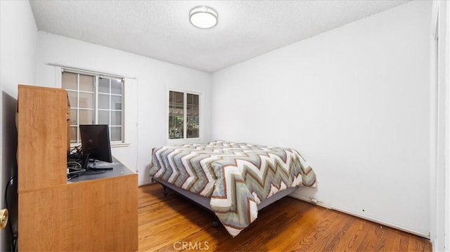 3139 W 152nd Pl, Gardena, CA 90249 - bedroom featuring wood finished floors and a textured ceiling