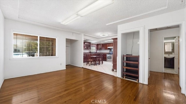 3139 W 152nd Pl, Gardena, CA 90249 - living room with light wood-style flooring and a textured ceiling