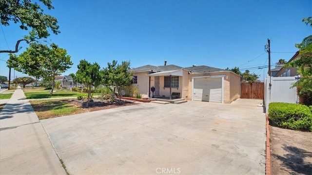3139 W 152nd Pl, Gardena, CA 90249 - view of front of house featuring a garage, driveway, and stucco siding