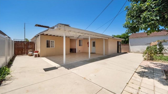 3139 W 152nd Pl, Gardena, CA 90249 - back of property with a carport, driveway, a patio area, and stucco siding