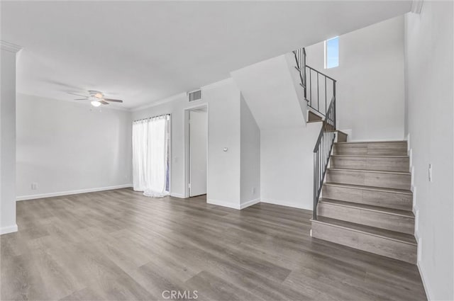 250 W Spazier Ave Unit 209, Burbank, CA 91502 - unfurnished living room with ceiling fan, stairway, wood finished floors, and crown molding