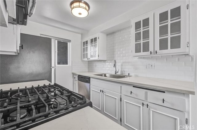 250 W Spazier Ave Unit 209, Burbank, CA 91502 - kitchen featuring dishwasher, glass insert cabinets, decorative backsplash, and light stone countertops