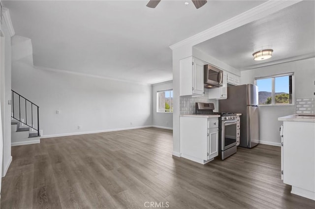 250 W Spazier Ave Unit 209, Burbank, CA 91502 - kitchen featuring stainless steel appliances, white cabinets, ceiling fan, light countertops, and dark wood-style floors