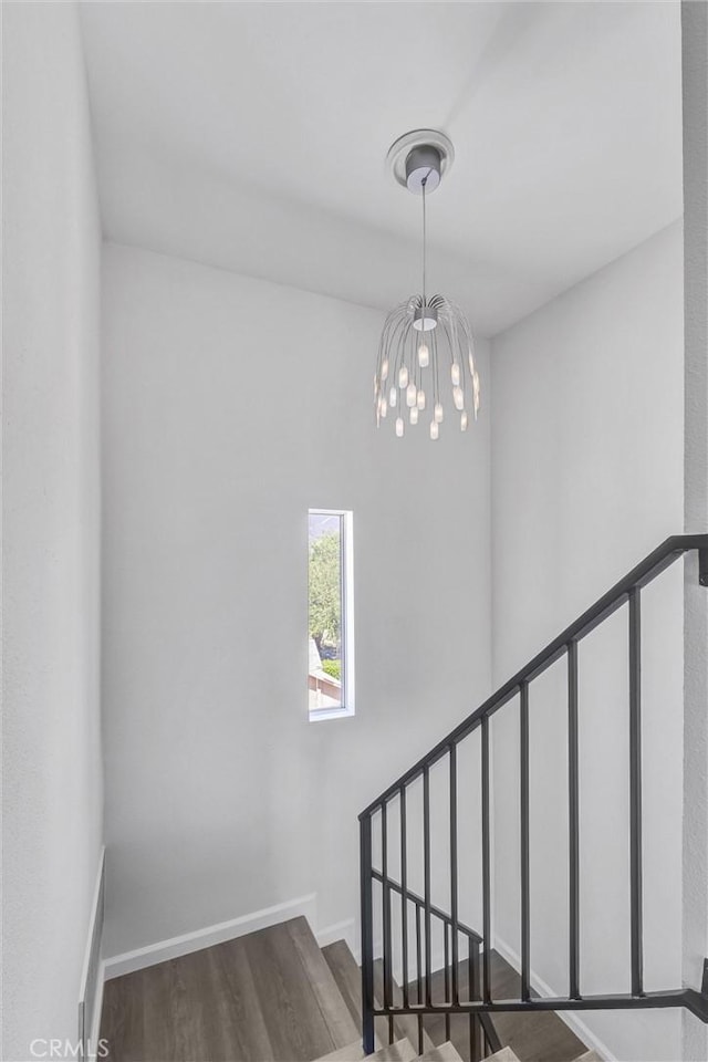 250 W Spazier Ave Unit 209, Burbank, CA 91502 - stairway featuring wood finished floors and a chandelier