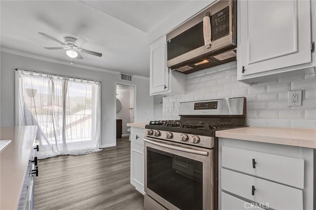 250 W Spazier Ave Unit 209, Burbank, CA 91502 - kitchen featuring stainless steel appliances, ornamental molding, light countertops, decorative backsplash, and ceiling fan