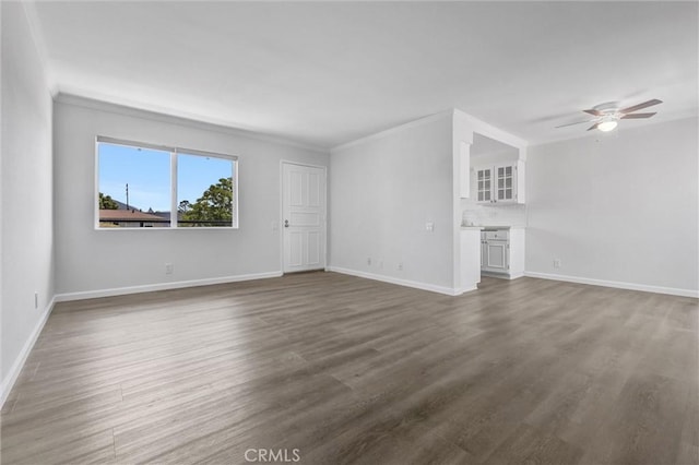 250 W Spazier Ave Unit 209, Burbank, CA 91502 - unfurnished living room with ceiling fan, dark wood-type flooring, and ornamental molding