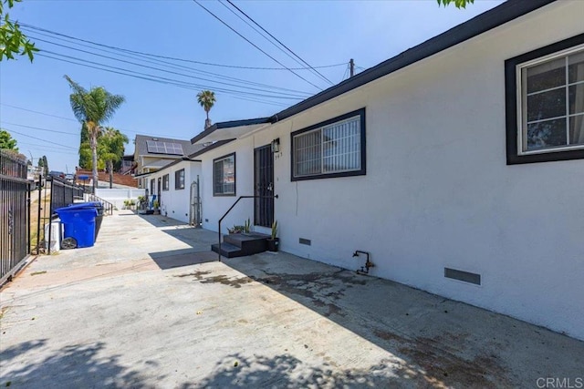 53945 S 36th St, San Diego, CA 92113 - view of front of property featuring crawl space, a patio, and stucco siding