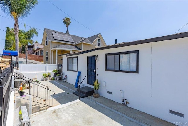 53945 S 36th St, San Diego, CA 92113 - view of front of house with stucco siding and a patio