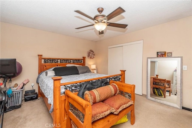 1267 Joshua Tree Dr, Barstow, CA 92311 - bedroom with light colored carpet, a closet, and ceiling fan