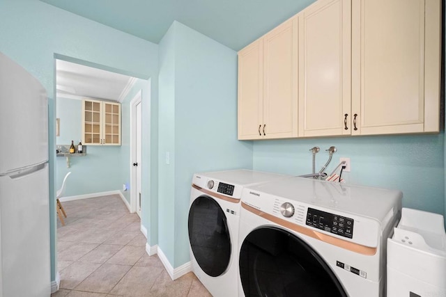 4562 Golden Ridge Dr, Oceanside, CA 92056 - washroom with washing machine and clothes dryer, cabinet space, and light tile patterned floors