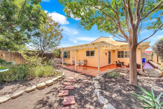 4562 Golden Ridge Dr, Oceanside, CA 92056 - back of property featuring a fenced backyard and a deck