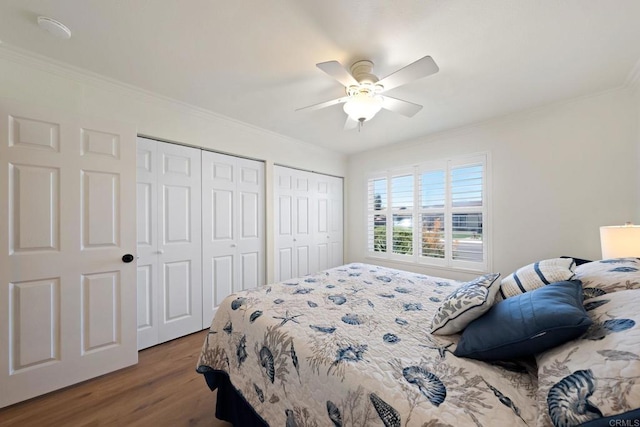 4562 Golden Ridge Dr, Oceanside, CA 92056 - bedroom with multiple closets, wood finished floors, ornamental molding, and ceiling fan