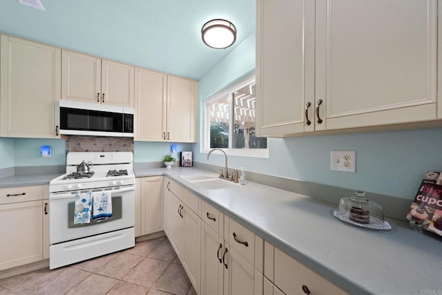 4562 Golden Ridge Dr, Oceanside, CA 92056 - kitchen featuring white appliances, light countertops, decorative backsplash, and light tile patterned floors