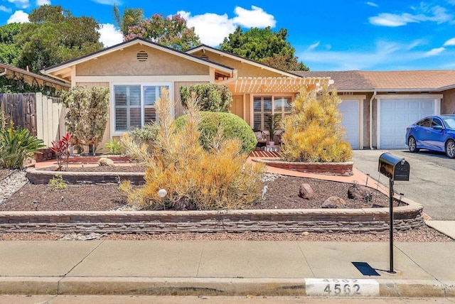 4562 Golden Ridge Dr, Oceanside, CA 92056 - ranch-style home with a garage, asphalt driveway, and stucco siding