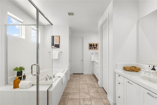 19162 Lauren Ln, Saugus, CA 91350 - bathroom featuring vanity, a bath, and a stall shower