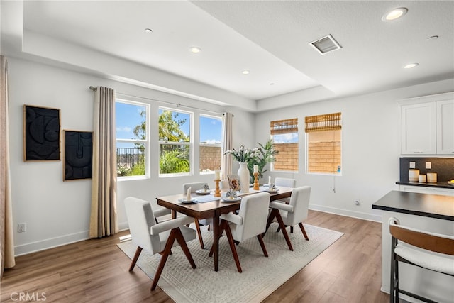 19162 Lauren Ln, Saugus, CA 91350 - dining room with recessed lighting, light wood finished floors, and a tray ceiling