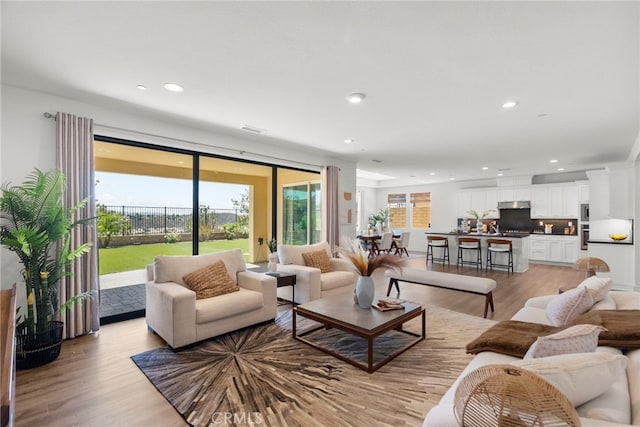 19162 Lauren Ln, Saugus, CA 91350 - living area with light wood-style flooring and recessed lighting