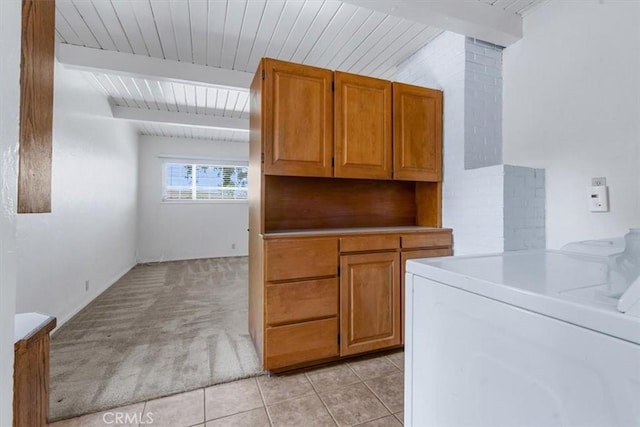 2516 Greta Pl, San Luis Obispo, CA 93401 - washroom featuring washer / clothes dryer, light carpet, light tile patterned flooring, wooden ceiling, and cabinet space