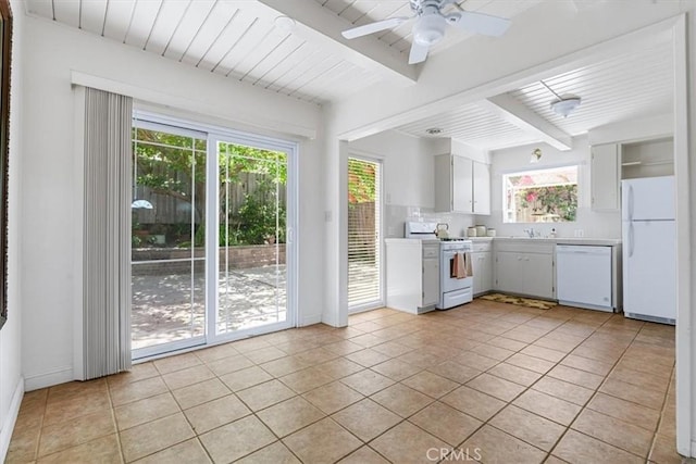 2516 Greta Pl, San Luis Obispo, CA 93401 - kitchen with white appliances, plenty of natural light, light countertops, light tile patterned floors, and a wood ceiling with exposed beams