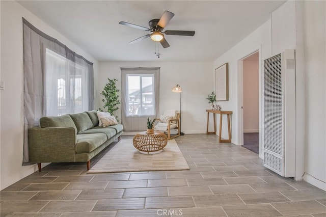 1327 Exposition Blvd, Los Angeles, CA 90018 - living area with a heating unit, ceiling fan, and wood tiled floors