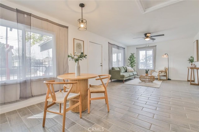 1327 Exposition Blvd, Los Angeles, CA 90018 - dining room with wood tiled floors and ceiling fan