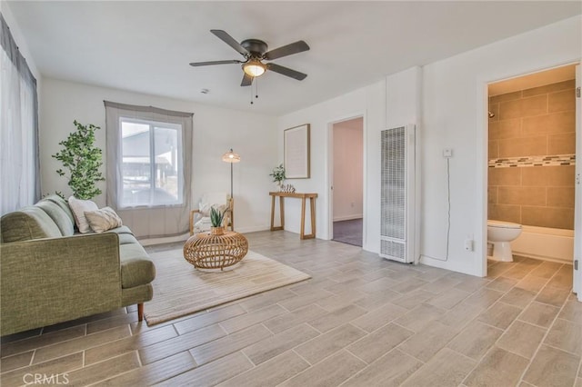 1327 Exposition Blvd, Los Angeles, CA 90018 - living area featuring a heating unit and a ceiling fan