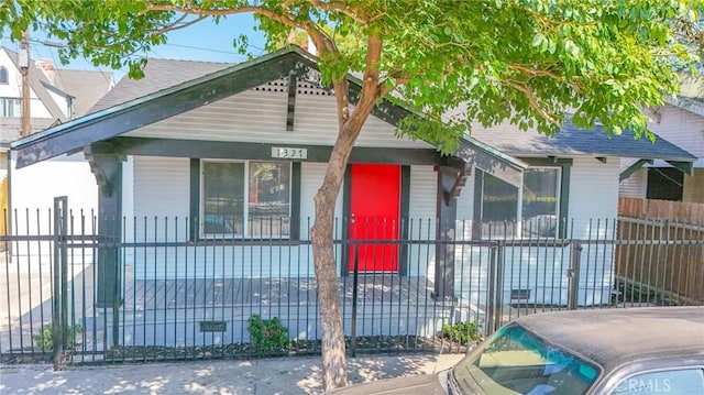 1327 Exposition Blvd, Los Angeles, CA 90018 - view of front facade with a fenced front yard and a porch