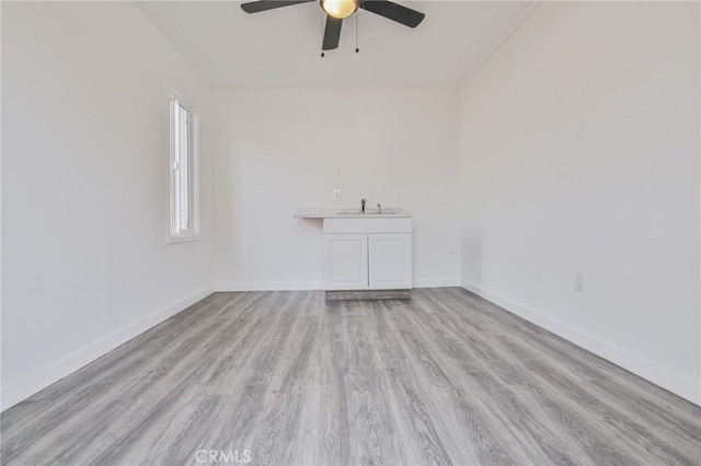 1327 Exposition Blvd, Los Angeles, CA 90018 - spare room with a ceiling fan and wood finished floors